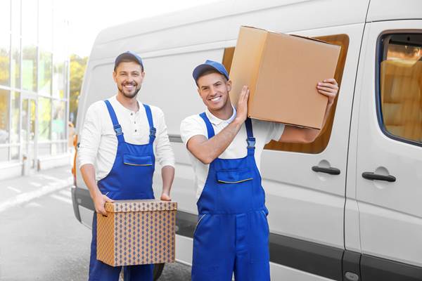 Workers next to company van